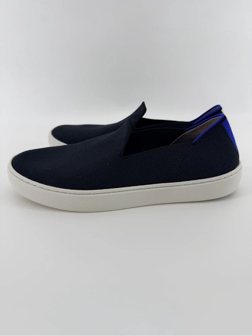 Rothy's Black Knit Original Slip-On Sneakers with Blue & White Heel Tabs